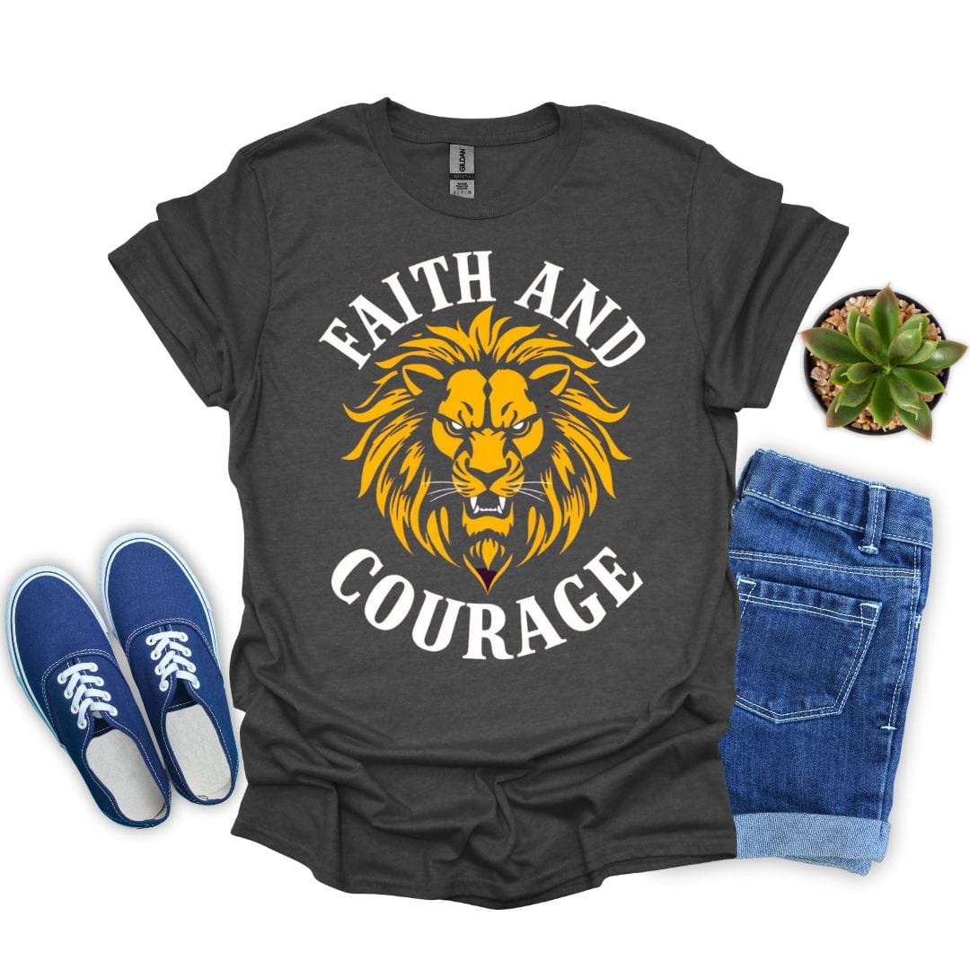 Dark heather t-shirt with lion graphic and 'Faith and Courage' text, paired with blue sneakers and jeans on a white background.
