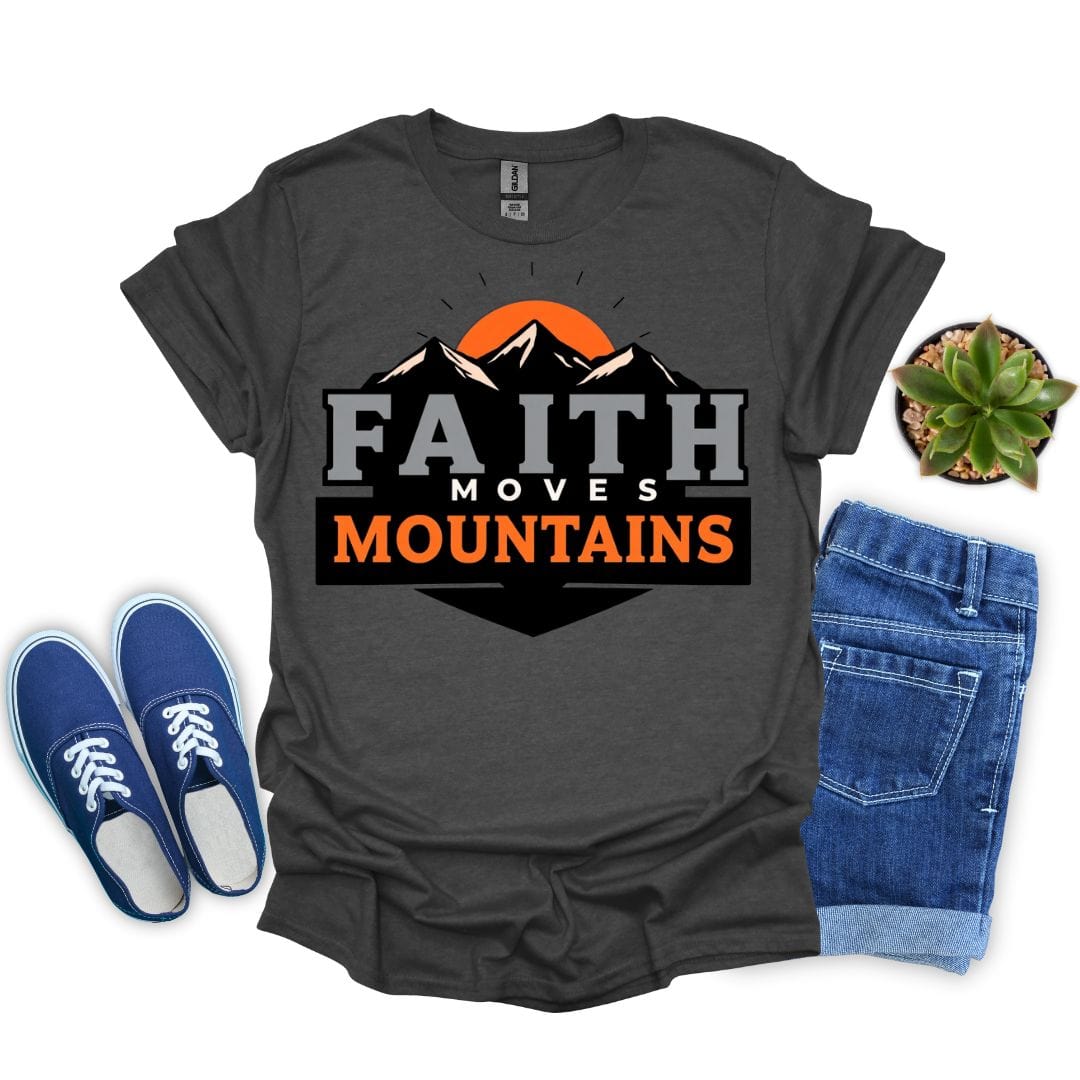 Dark heather t-shirt with 'Faith Moves Mountains' graphic, blue sneakers, denim shorts, and a plant on a white background.