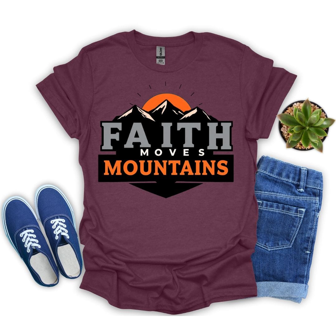 Maroon t-shirt with 'Faith Moves Mountains' graphic, blue sneakers, and jeans on a white background