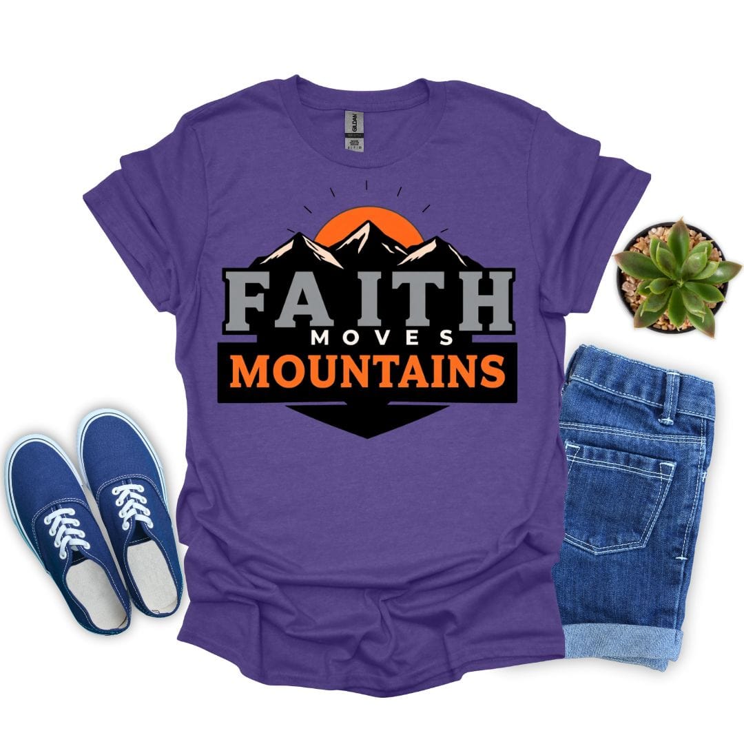 Heather purple t-shirt with 'Faith Moves Mountains' design, blue sneakers, denim shorts, and a small plant on a white background.