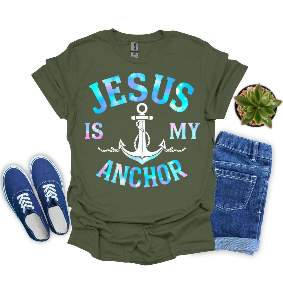 Military green t-shirt with 'Jesus is my anchor' design, blue sneakers, and jeans on a white background