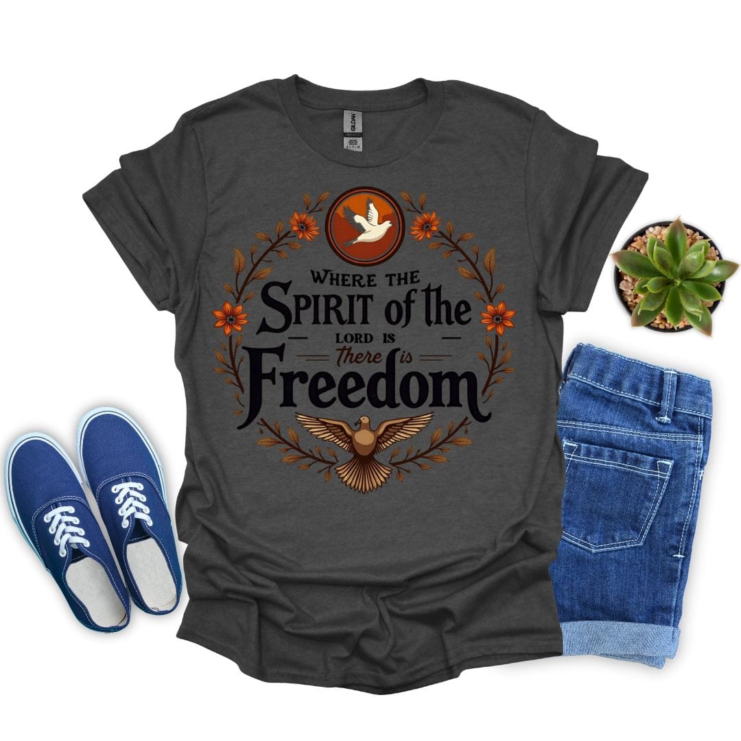 Dark heather t-shirt with 'Where the Spirit of the Lord is, There is Freedom' design, blue sneakers, and jeans on a white background.