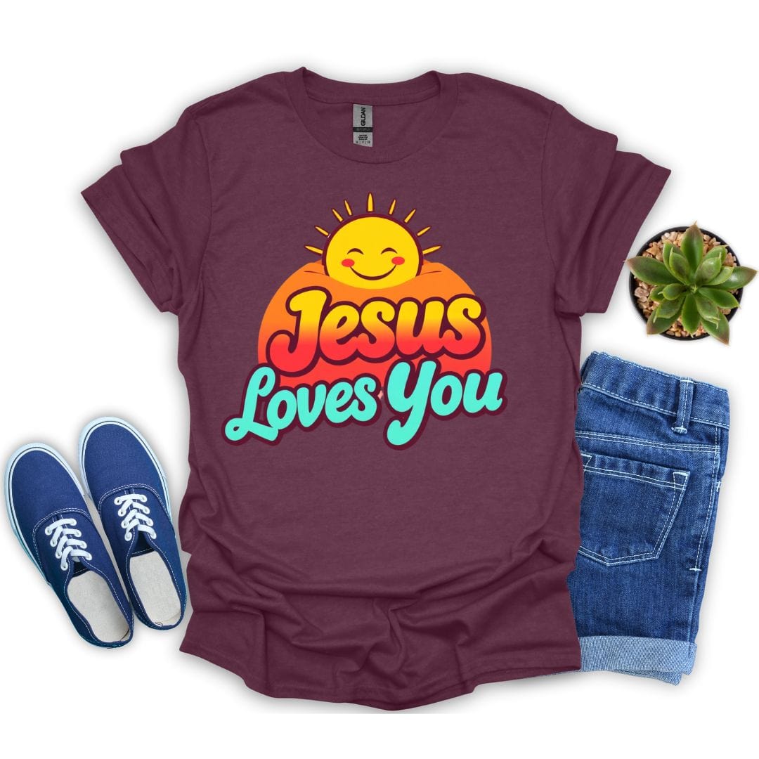 Maroon t-shirt with 'Jesus Loves You' design, blue sneakers, and jeans on a white background