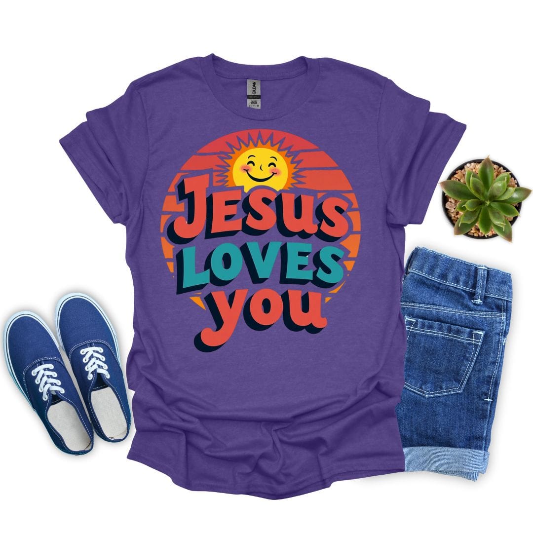 Heather purple t-shirt with 'Jesus Loves You' design, blue sneakers, denim shorts, and a small plant on a white background.