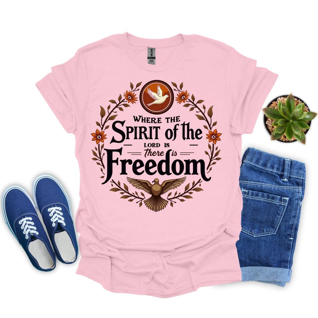 Light pink t-shirt with 'Where the Spirit of the Lord is, there is Freedom' design, paired with blue sneakers and jeans on a white background.