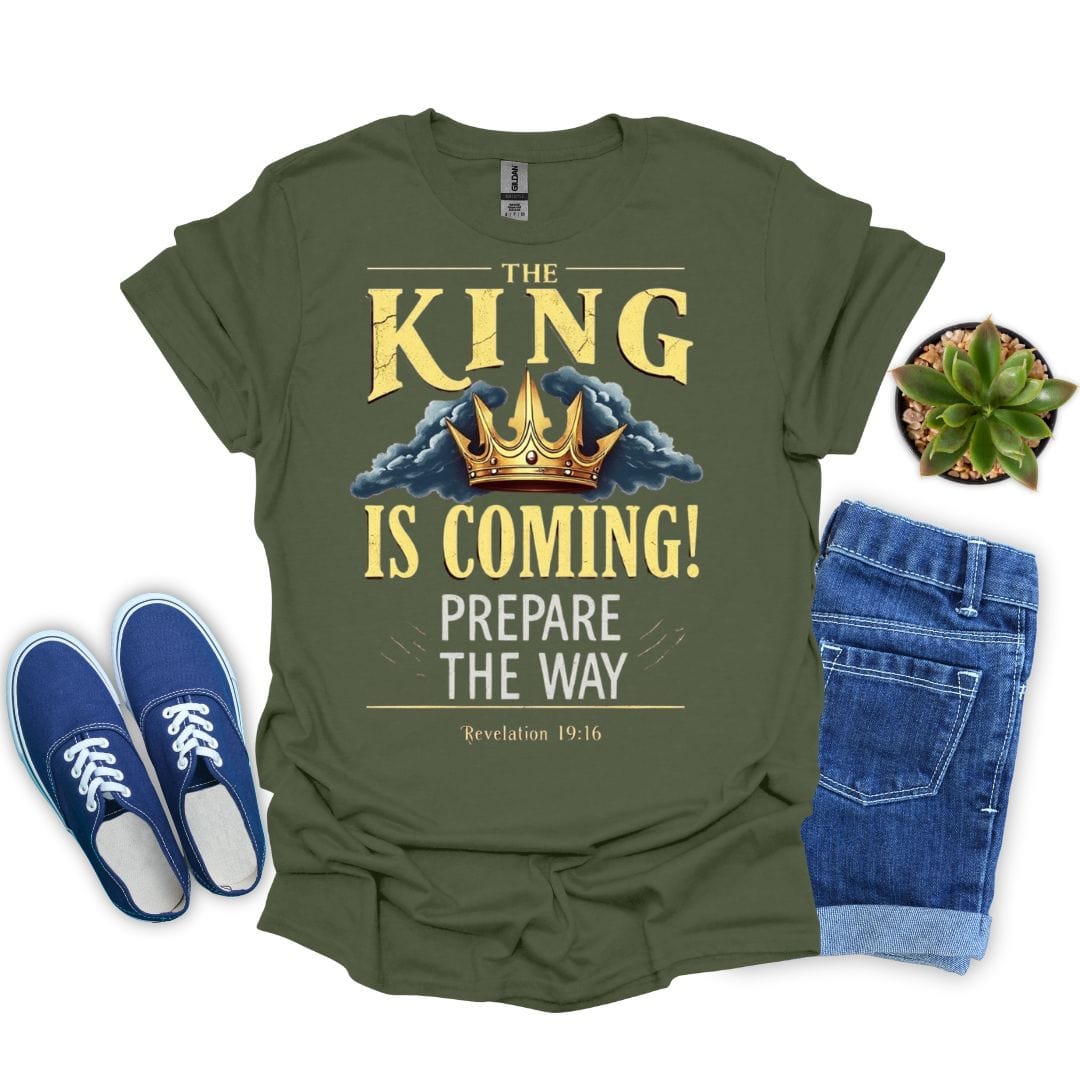 Military Green t-shirt with 'The King is Coming!' text, blue sneakers, and jeans on a white background