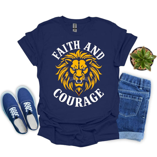 Navy blue t-shirt with yellow lion graphic and 'Faith and Courage' text, paired with blue sneakers and jeans on a white background.