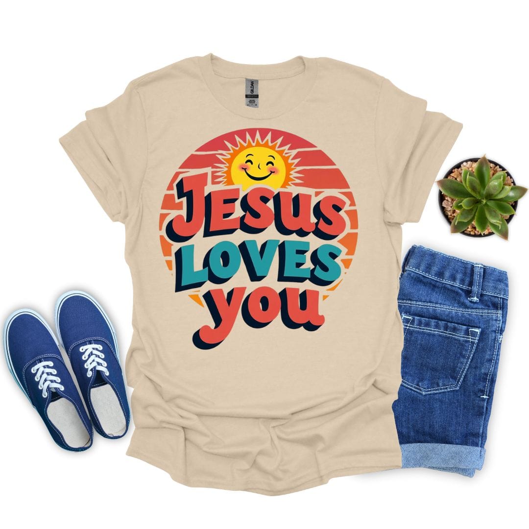 Sand t-shirt with 'Jesus Loves You' design, blue sneakers, and denim shorts on a white background