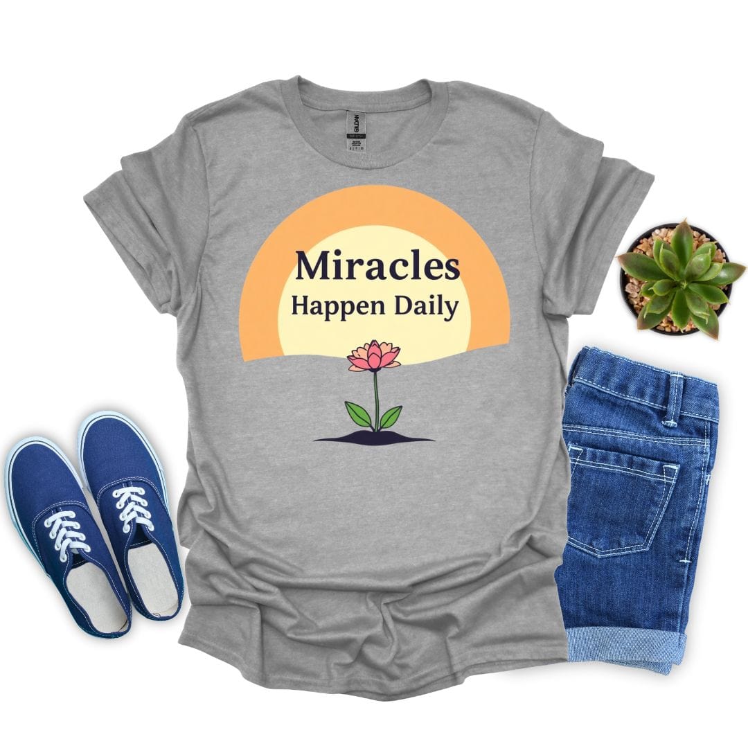 Sport gray t-shirt with 'Miracles Happen Daily' design, blue sneakers, and denim shorts on a white background.